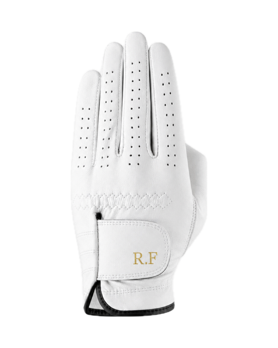 The Monogram Glove in white cabretta, initials R.F in gold foil on the wrist strap.